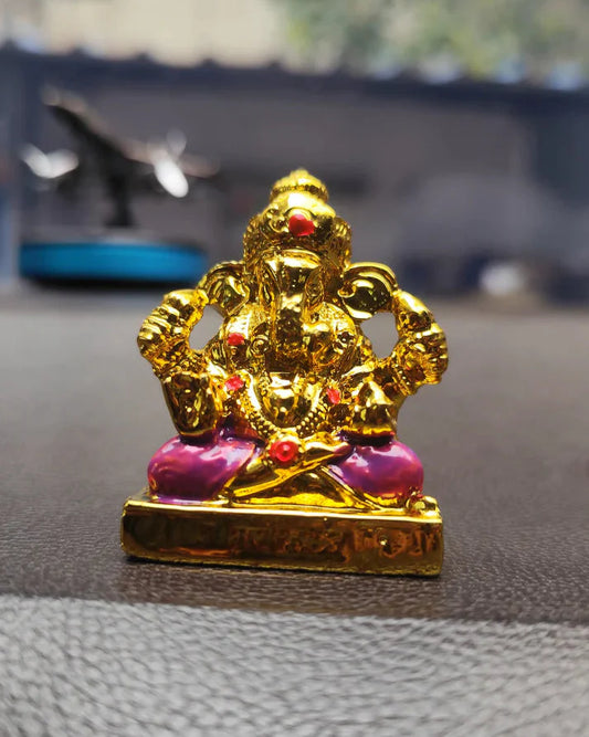 Elegant Golden Lord Ganesha Idol with Pink Dhoti